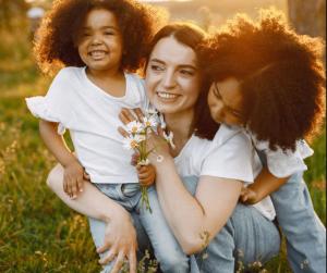 A mother pictured with her 2 young daughters.