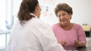 A picture of a doctor consulting a female, elderly patient.