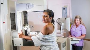 An image of a woman having a mammogram.