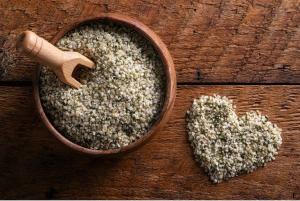 An image of hemp seeds, formed into a heart shape.