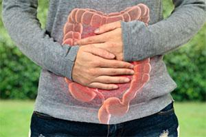 An image of a person holding their stomach.