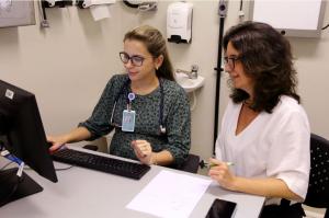 Dr. Giovana Teixeira, study physician and medical coordinator, and Mrs. Flavia Amancio, study coordinator.