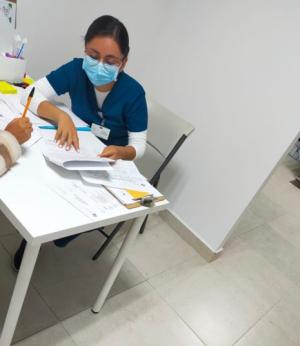 A site coordinator reviewing the informed consent with a patient.