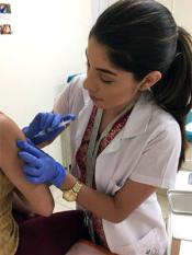 A nurse administers the HPV vaccine to a participant in the NCI-funded Costa Rica HPV Vaccine Trial.