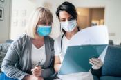 A nurse consults with a patient during Coronavirus quarantine.