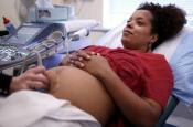 A pregnant woman gettign an ultrasound.